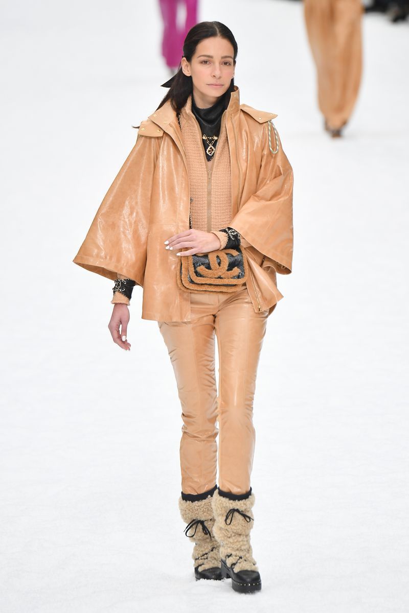 Fashion show, Fashion, Runway, Fashion model, Clothing, Outerwear, Brown, Human, Public event, Beige,