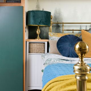 bedroom with brass bed and bedside table