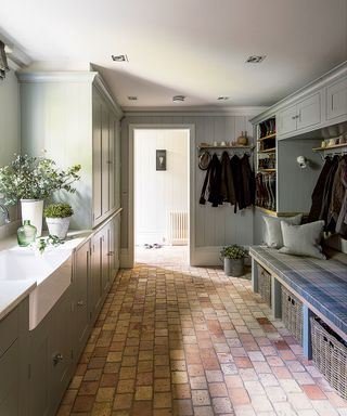 Laundry room organization with stone flooring