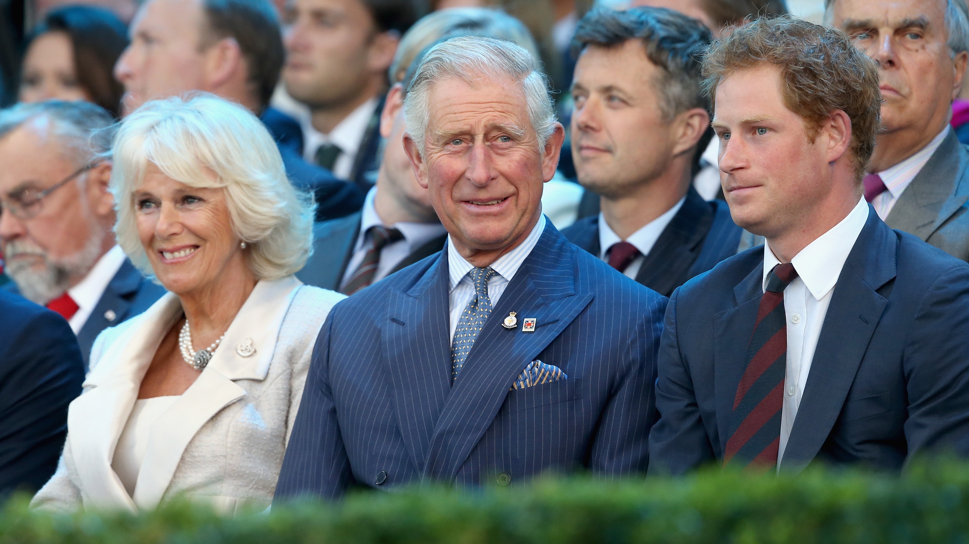 Queen Camilla, King Charles, Prince of Wales and Prince Harry laugh during the Invictus Games Opening Ceremony on September 10, 2014