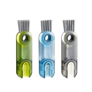 Three colorful 3-in-1 cleaning brushes