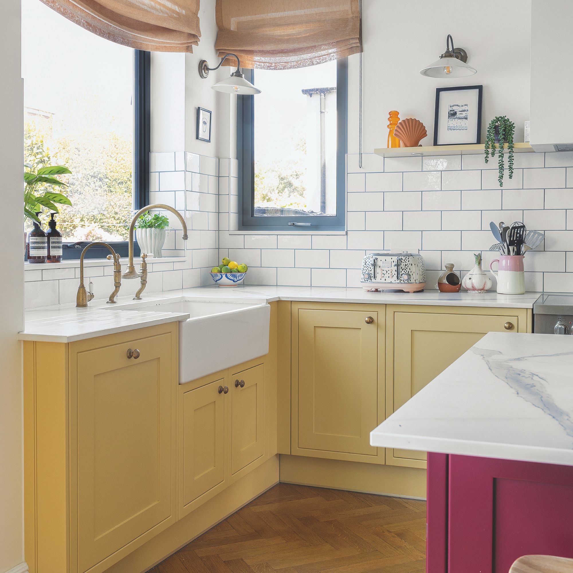 White painted and tiled kitchen with yellow kitchen cabinets