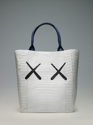 White bag with black handle and two black crosses