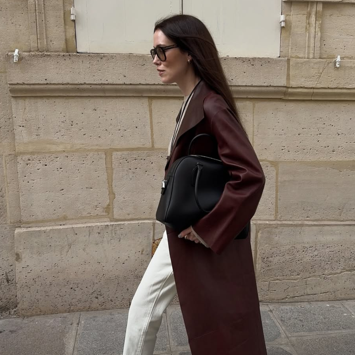 Annabel in a red leather trench and white jeans