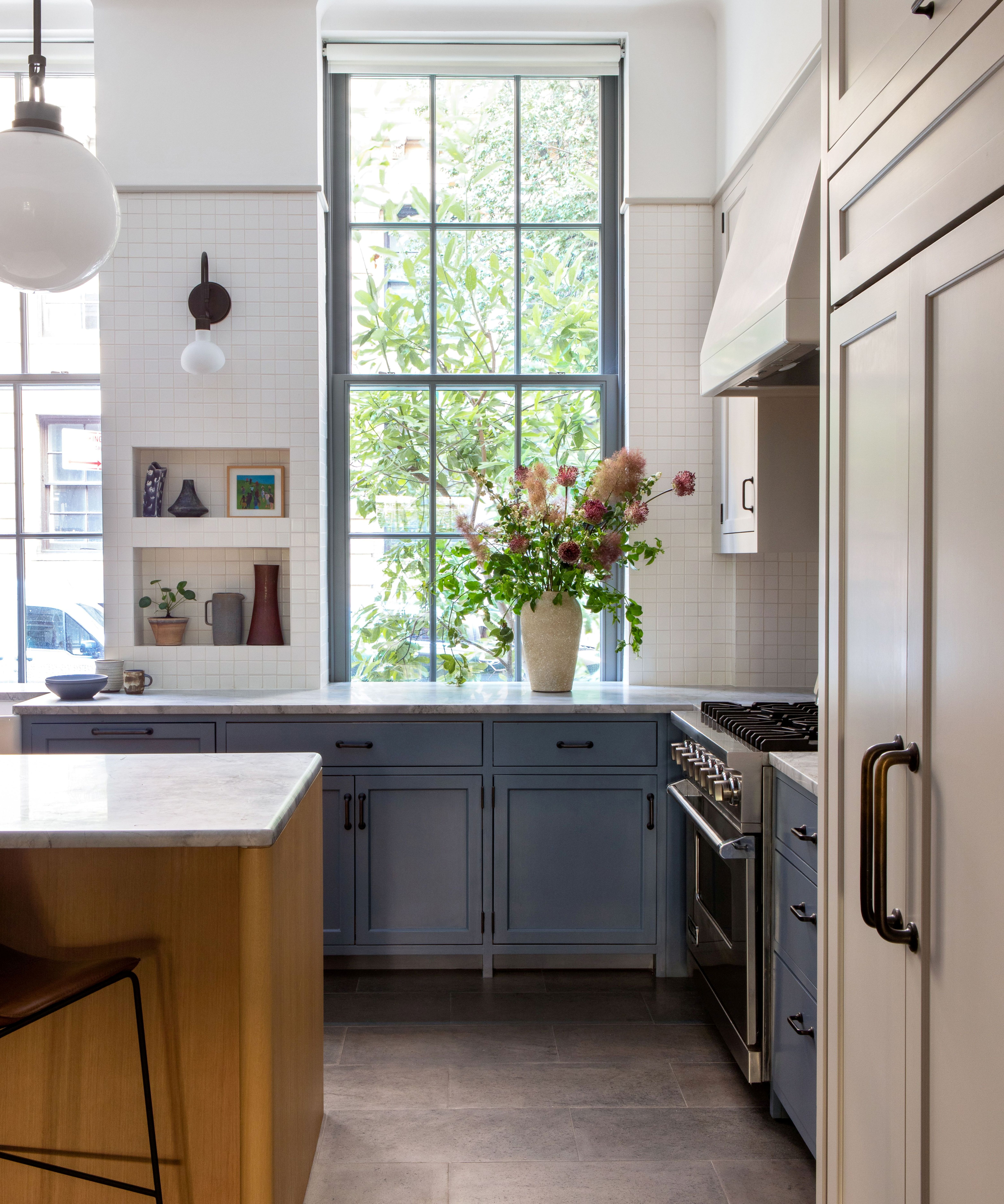 Blue kitchen with white tiles