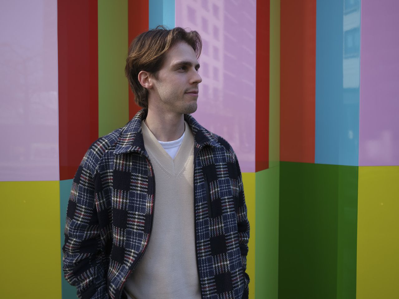 Fujifilm GFX100 RF sample images &ndash; portrait of a man in front of brightly colored wall