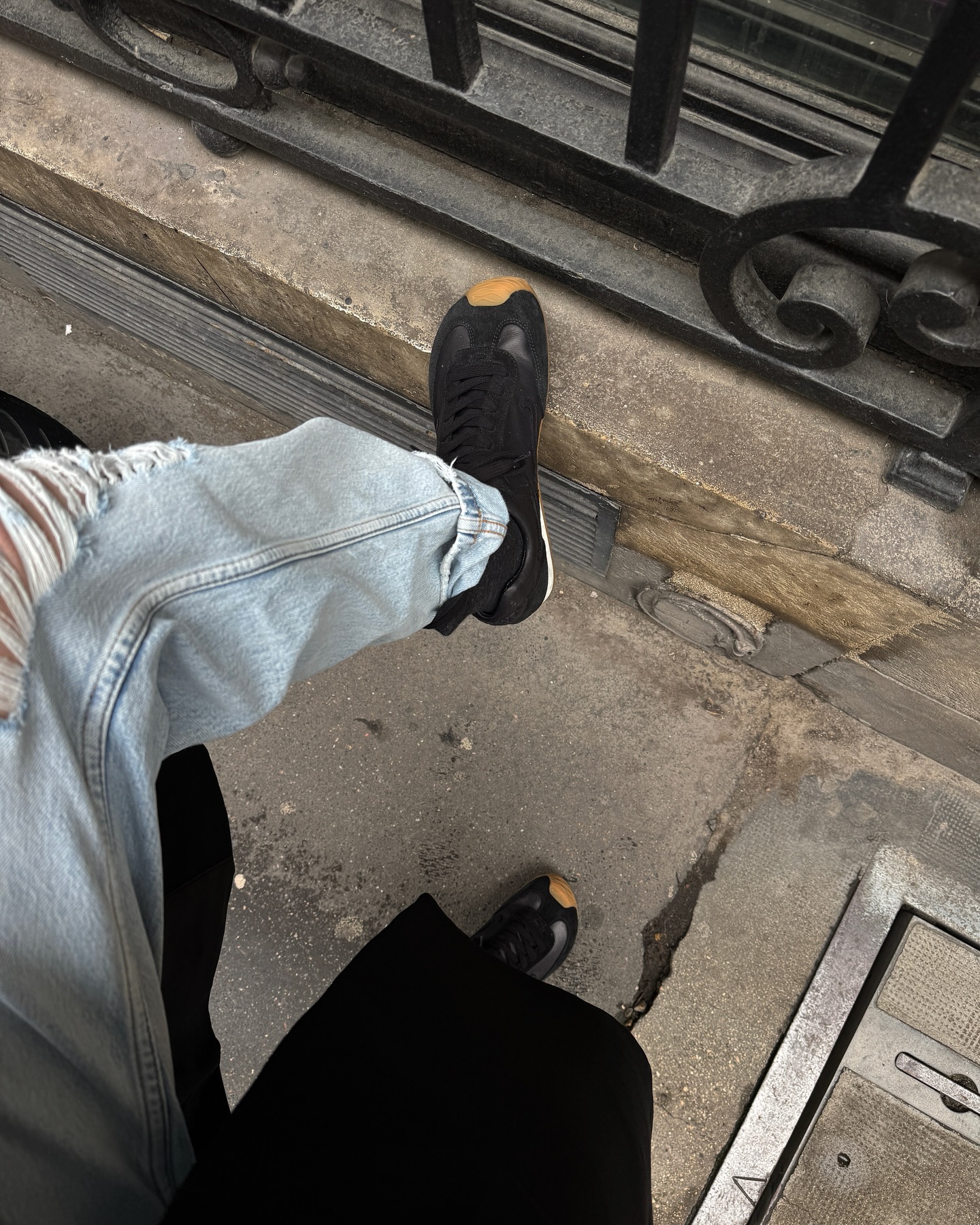 An image of @annabelrosendahl wearing one of the best black trainers for women, the Loewe ballet runners.