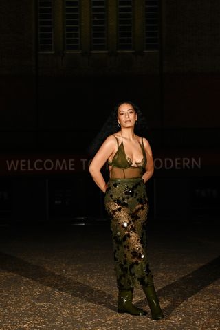 Solange Knowles in a green sheer dress at the Gucci Cruise 2025 show.