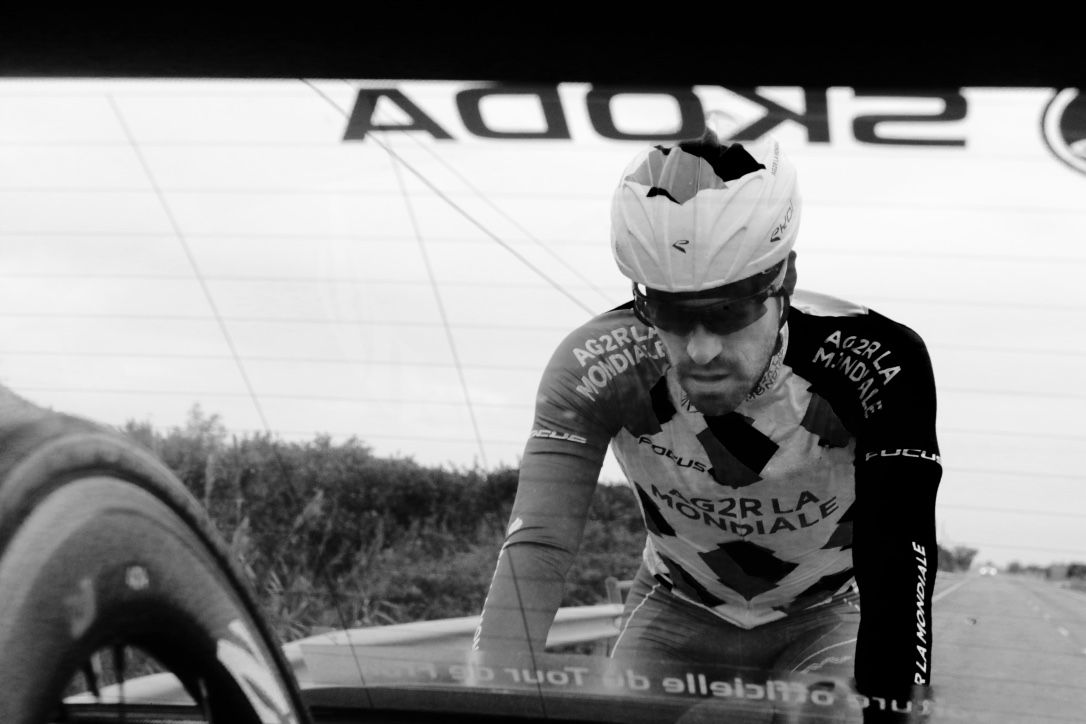 Christophe Riblon sits behind the team car
