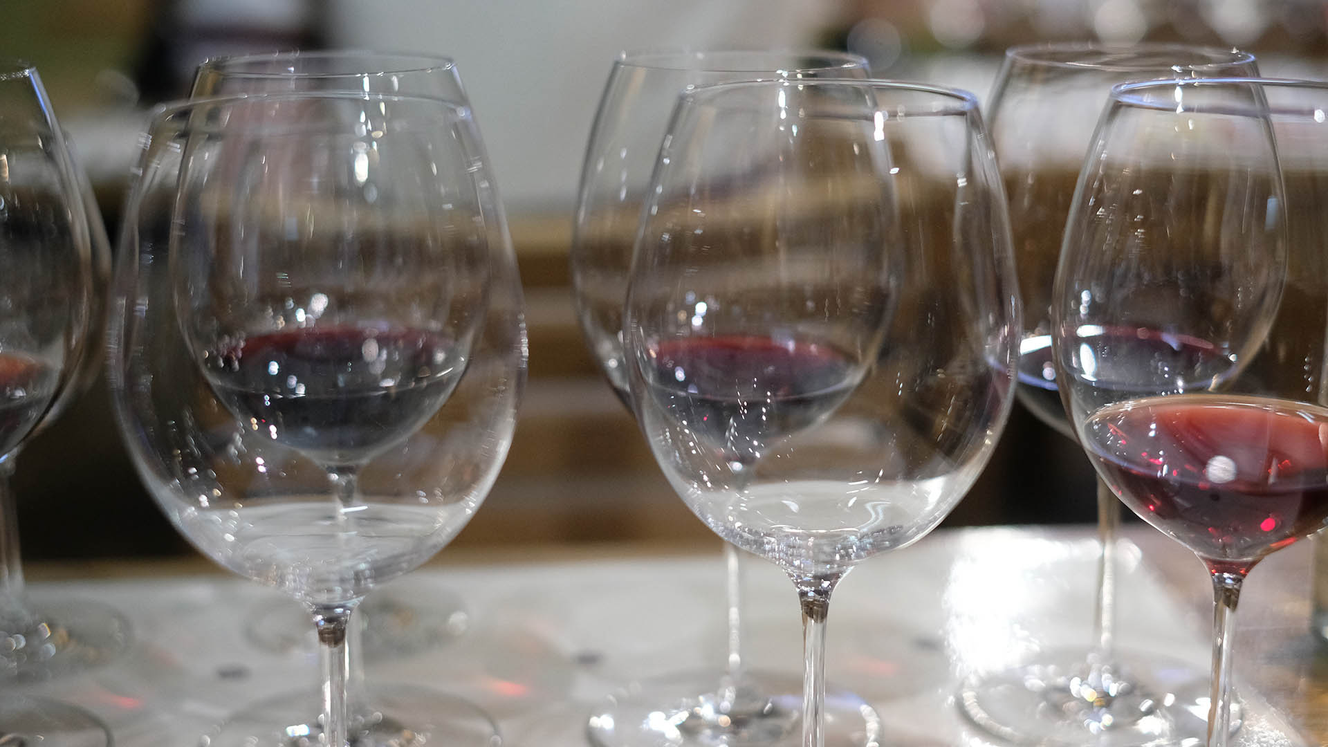 A photo of several wine glasses.