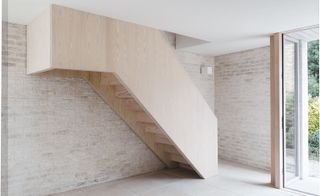 The floating staircase in London garage conversion