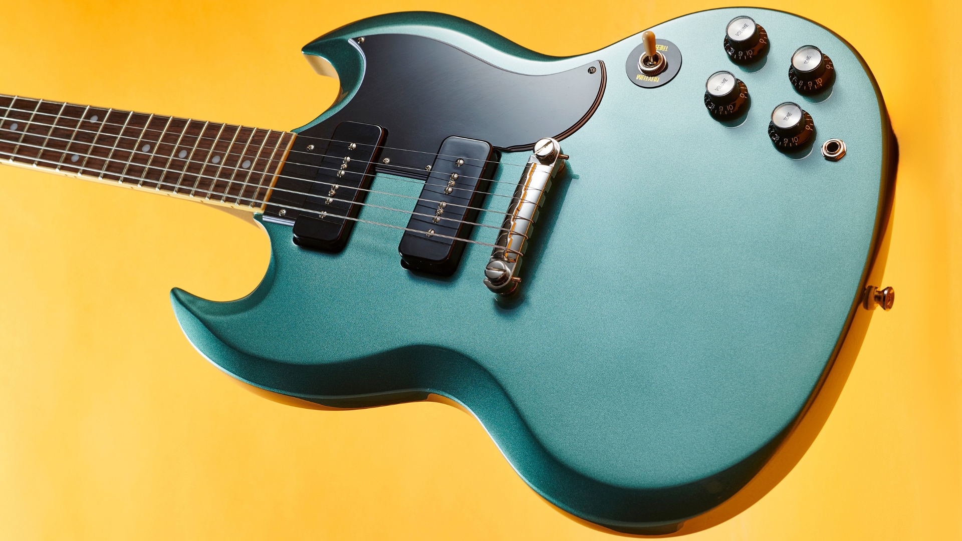An Epiphone SG Special P-90 on a yellow background