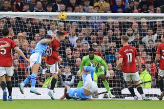 Rodri of Manchester City goes down after a collision with Rasmus Hojlund of Manchester United during the Premier League match between Manchester United and Manchester City at Old Trafford on October 29, 2023 in Manchester, England. (Photo by Simon Stacpoole/Offside/Offside via Getty Images)