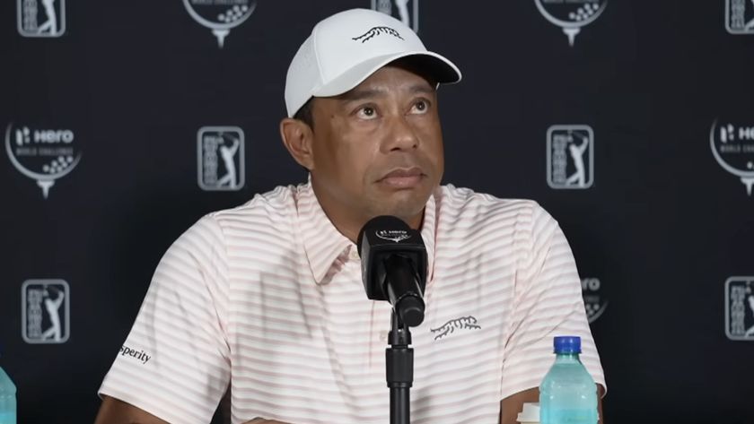Tiger Woods addresses journalists during a press conference.