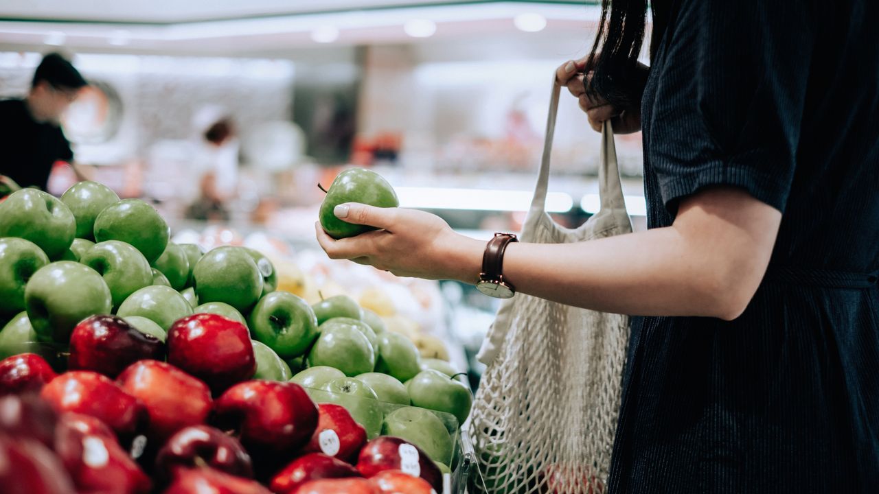 Woman shopping for fruit and vegetables