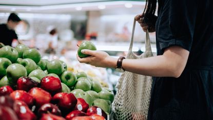 Woman shopping for fruit and vegetables