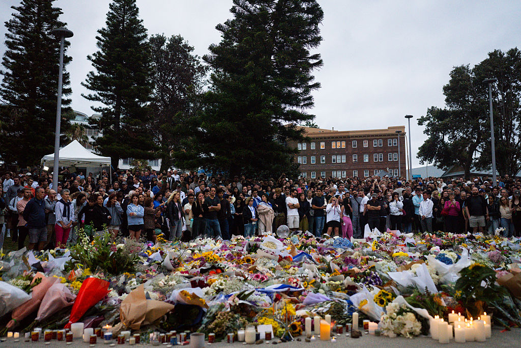 Community members gather outside of Bondi Pavilion at Bondi Beach. Police say at least 16 people, including one suspected gunman, were killed and more than a dozen others injured when two attackers opened fire near a Hanukkah celebration at the world-famous Bondi Beach.