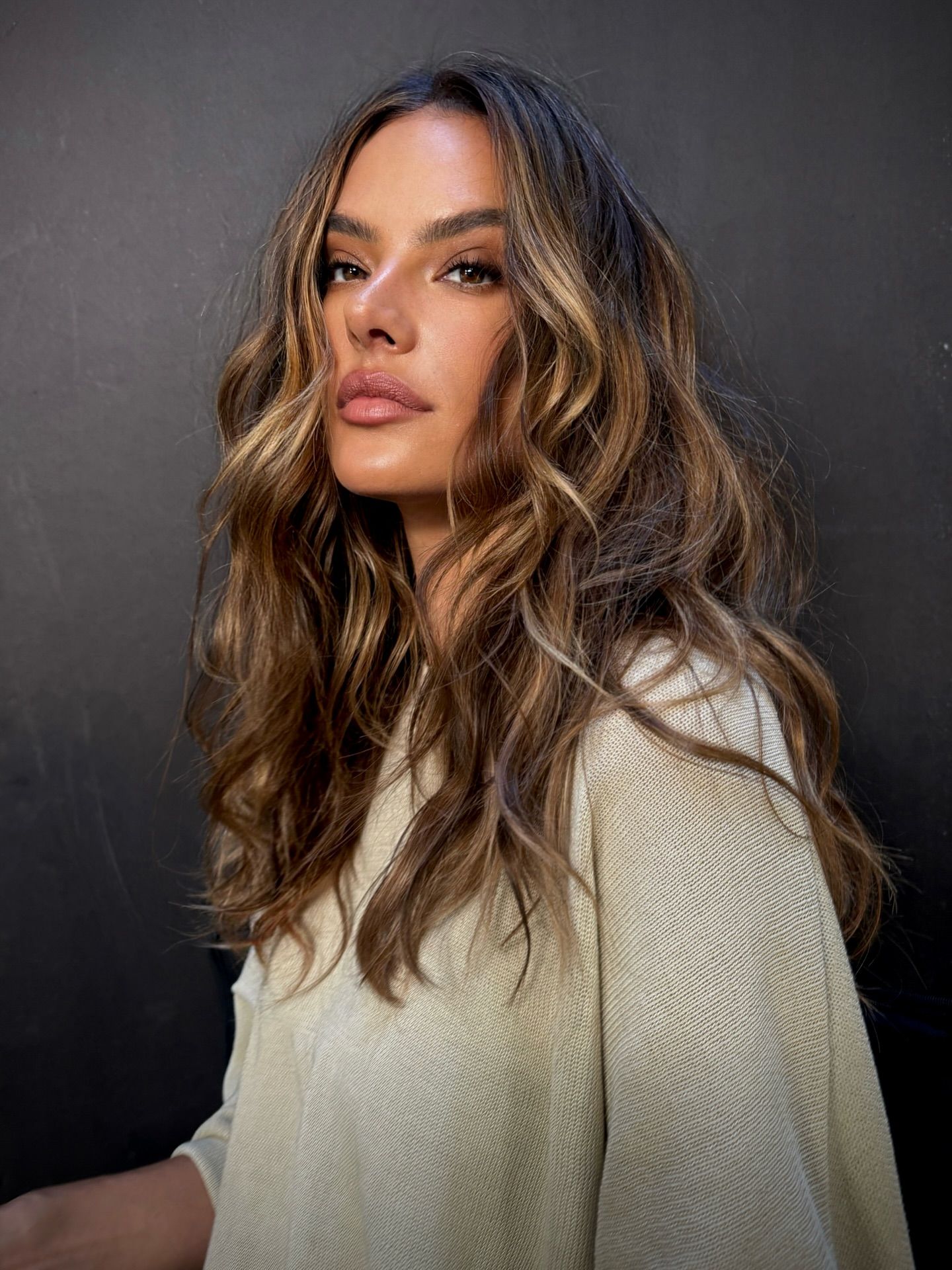 Alessandra Ambrosio with dark hair and blonde highlights