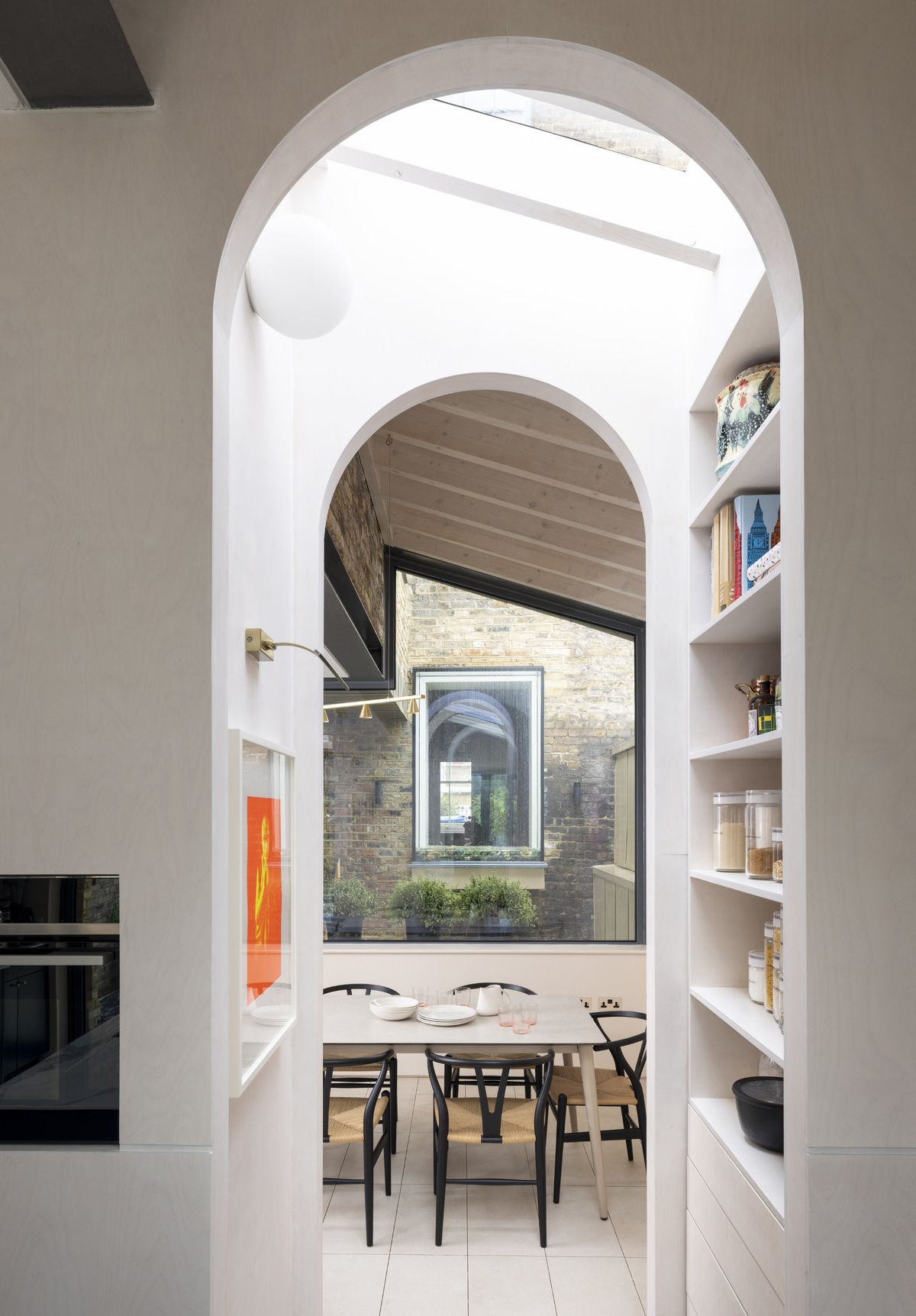 An arched corridor in a modern kitchen extension