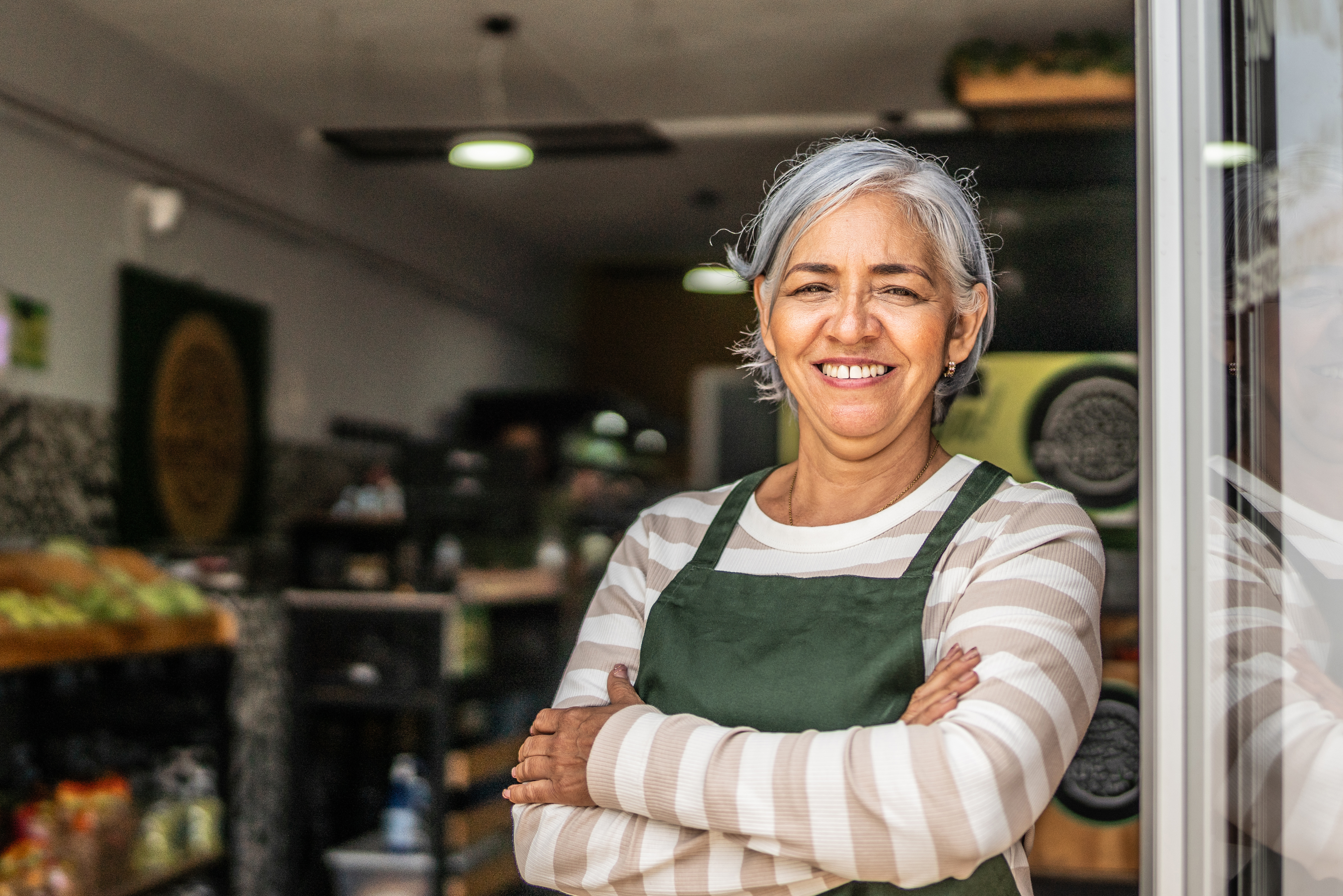 Portrait of senior woman working at store