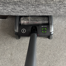 AirRAM 2 Core Cordless Vacuum positioned under sofa