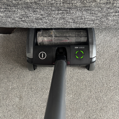 AirRAM 2 Core Cordless Vacuum positioned under sofa