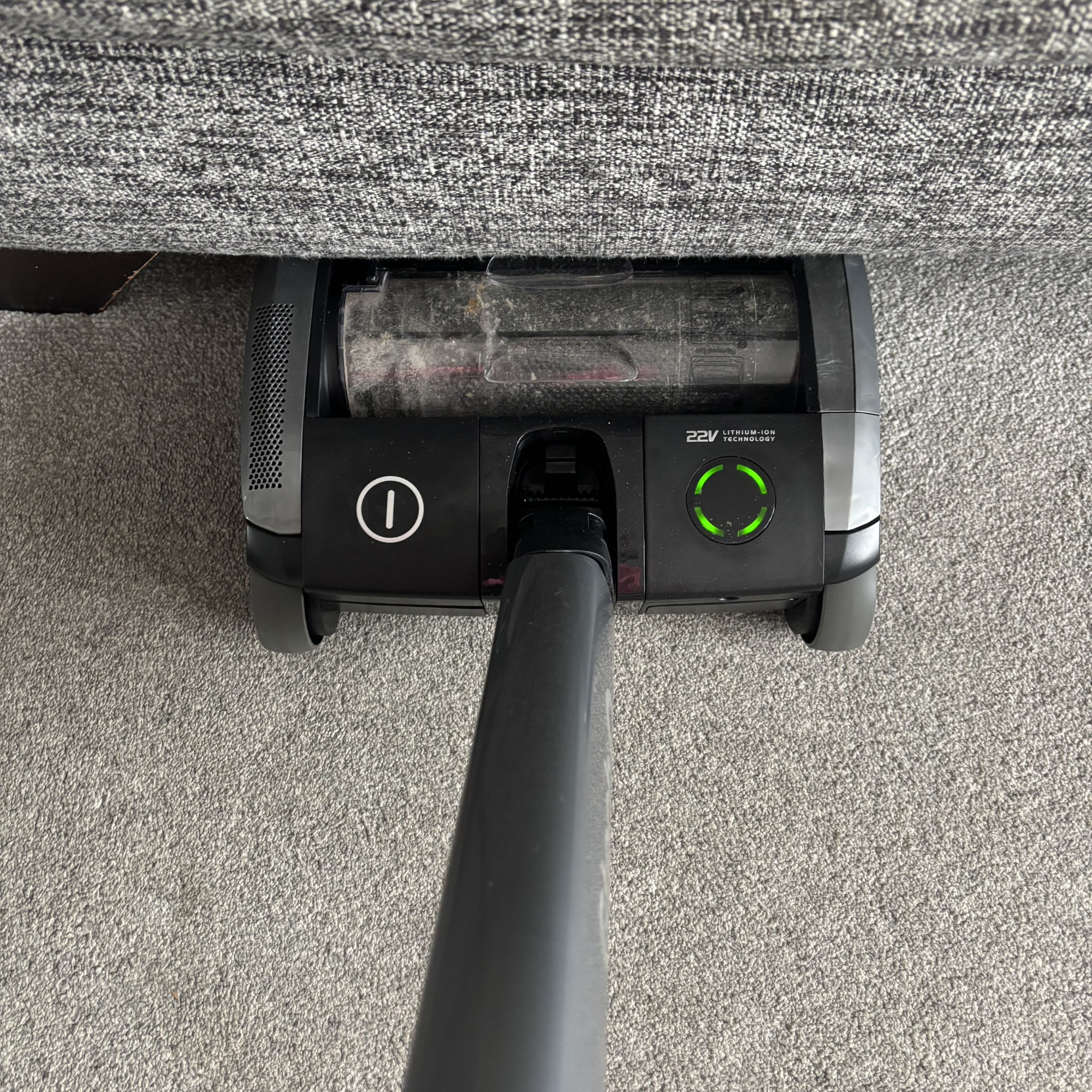 AirRAM 2 Core Cordless Vacuum positioned under sofa