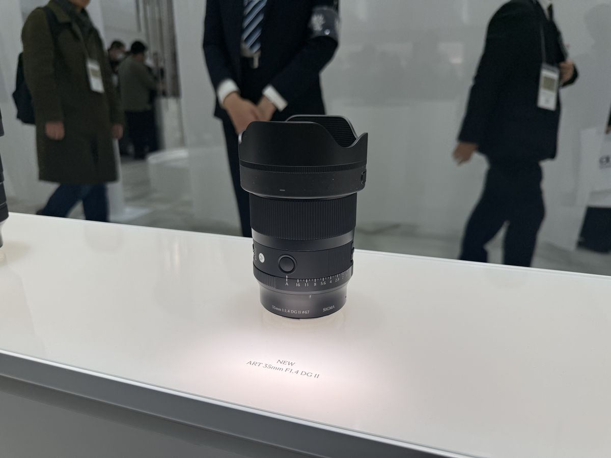 Sigma's 35mm F1.4 DG II Art lens on a white display surface at the CP+ 2026 show in Japan