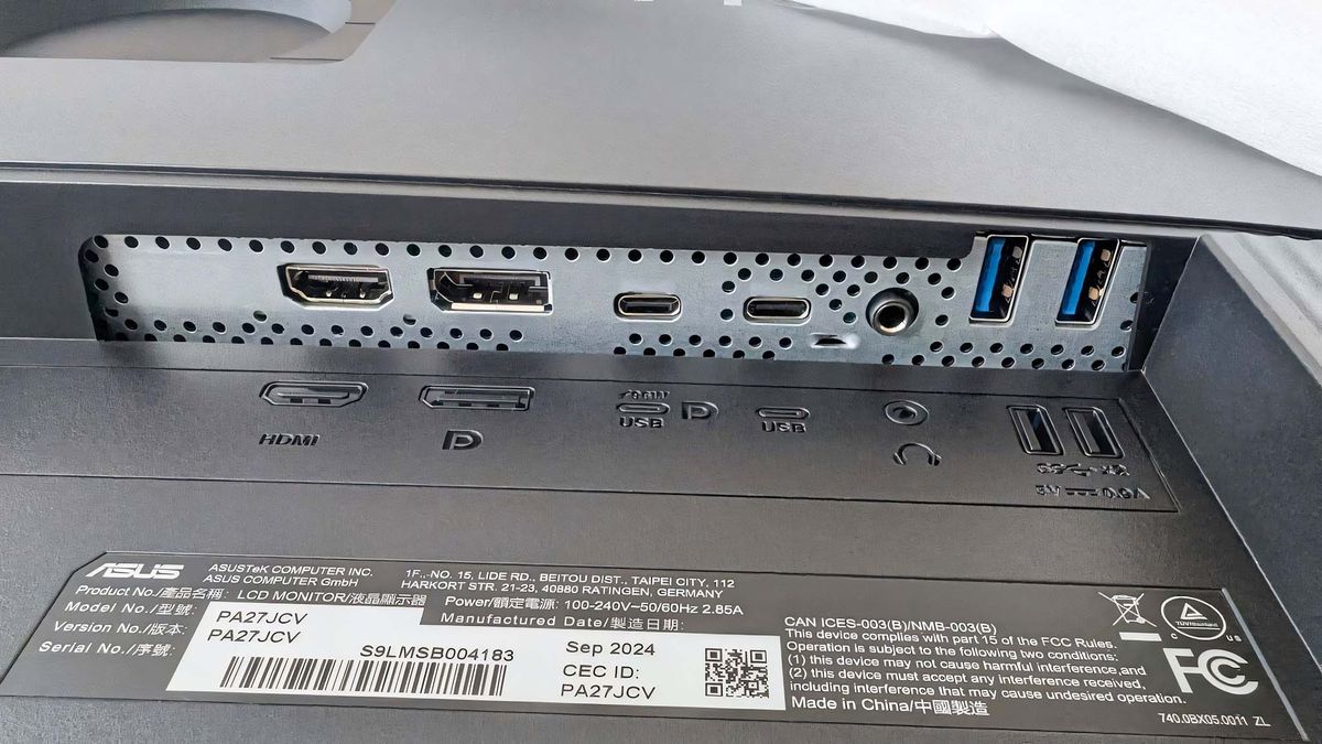 A close-up of the ASUS ProArt PA27JCV 's back ports showing an HDMI, DisplayPort, two USB-C, and two USB-A.