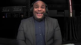 Daniel Cormier provides commentary during a UFC fight.