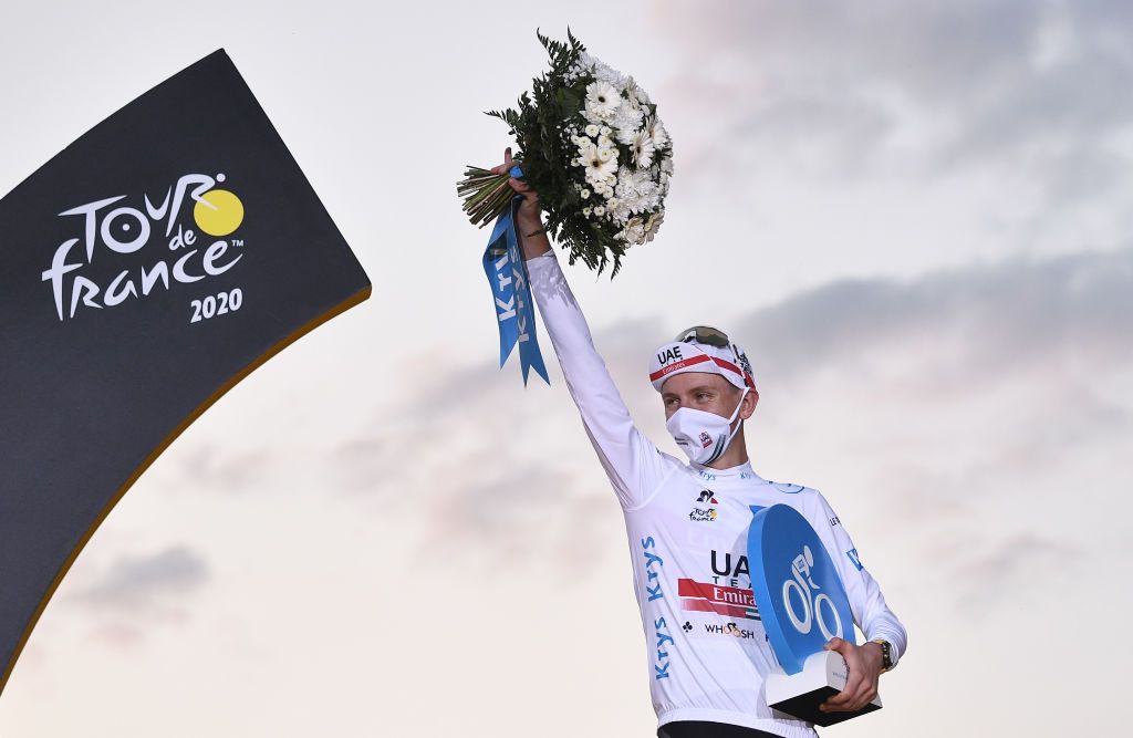 Team UAE Emirates rider Slovenias Tadej Pogacar celebrates on the podium after winning the white jersey of best young of the 107th edition of the Tour de France cycling race after the 21st and last stage of 122 km between ManteslaJolie and Champs Elysees Paris on September 20 2020 Photo by AnneChristine POUJOULAT AFP Photo by ANNECHRISTINE POUJOULATAFP via Getty Images