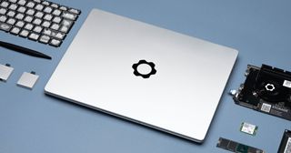 A lifestyle image of the Framework laptop surrounded by replaceable components 