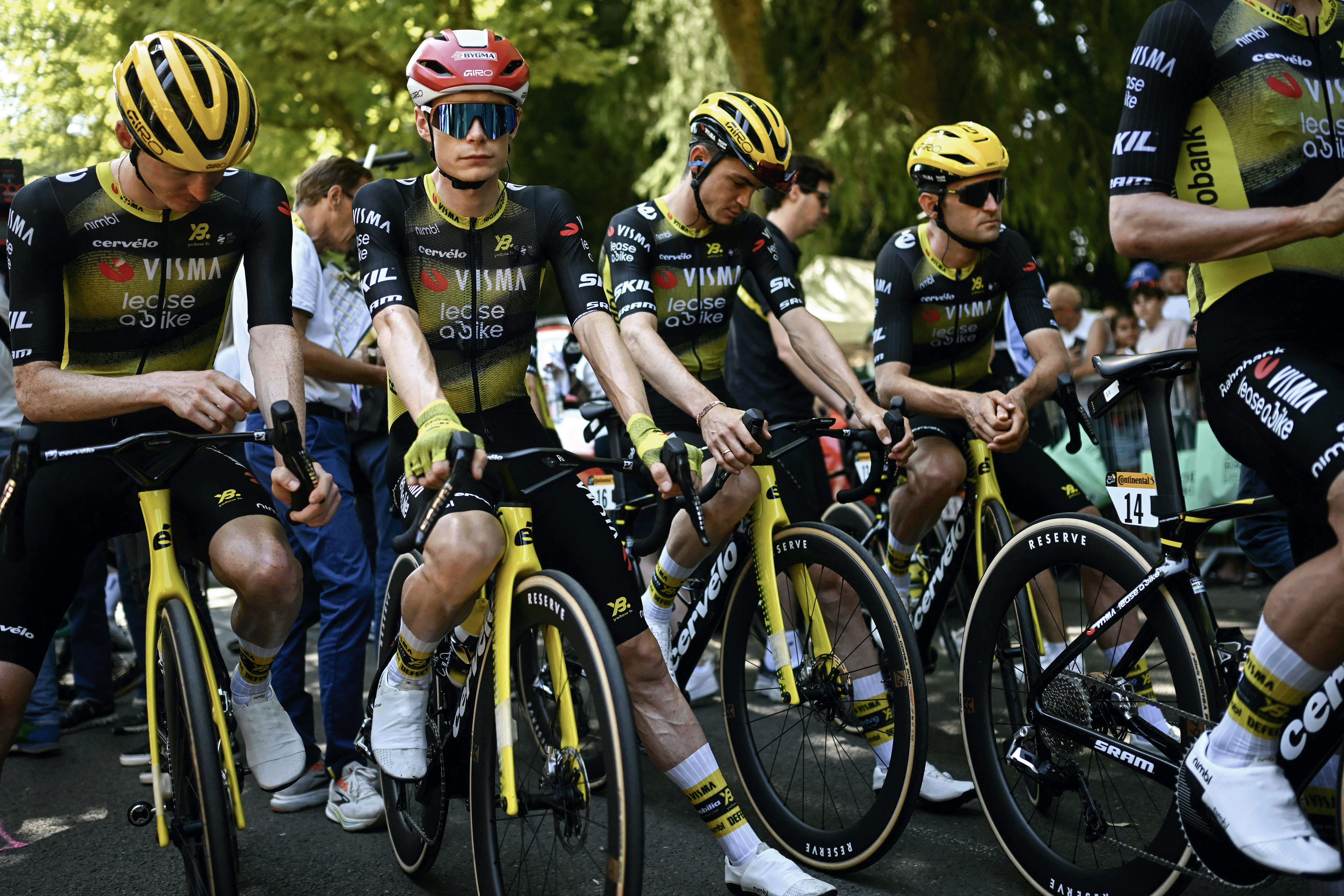 (From L) Team Visma - Lease a bike team's US rider Matteo Jorgenson, Team Visma - Lease a bike team's Danish rider Jonas Vingegaard and Team Visma - Lease a bike team's US rider Sepp Kuss, and Team Visma - Lease a bike team's Belgian rider Tiesj Benoot await the start of the 9th stage of the 112th edition of the Tour de France cycling race, 174.1 km between Chinon and Chateauroux, central France, on July 13, 2025. (Photo by Loic VENANCE / AFP) (Photo by LOIC VENANCE/AFP via Getty Images)
