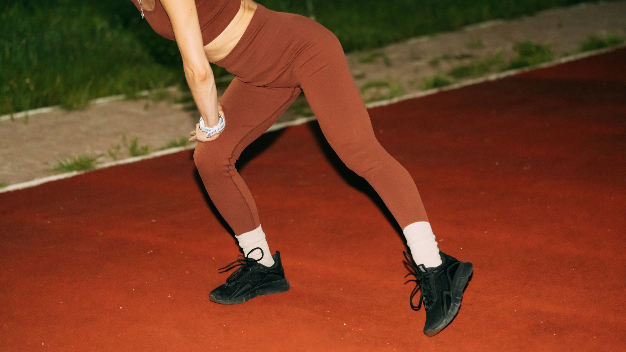 How to run faster: A woman warming up before a workout