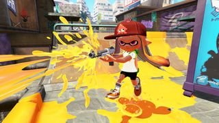 An inkling with orange hair in Splatoon on Wii U using a splat gun to cover the stage with orange paint