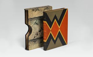 Book featuring embossed leather , marbled paper.