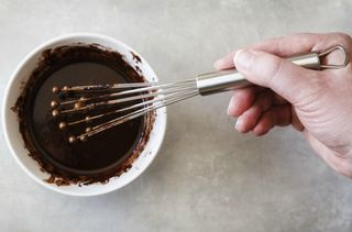 Whisking ganache for Reese's Pieces cake