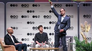 Sam Altman (C), US entrepreneur, investor, programmer, and founder and CEO of artificial intelligence company OpenAI, and the company&#039;s co-founder and chief scientist Ilya Sutskever (R), speak together at Tel Aviv University in Tel Aviv on June 5, 2023.