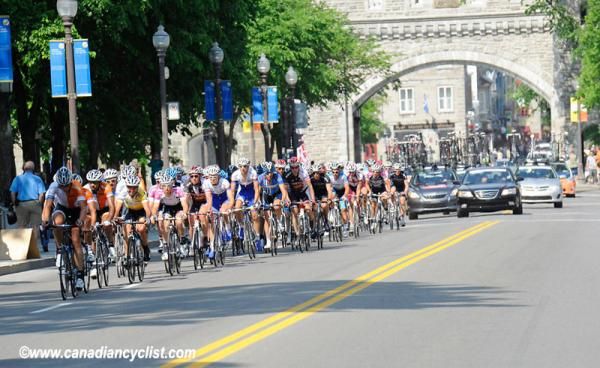 Peloton passes through the gate of the old fort