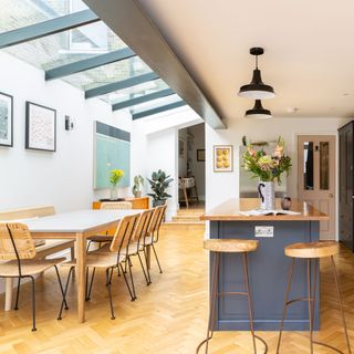 View over a dining table with a skylight overhead