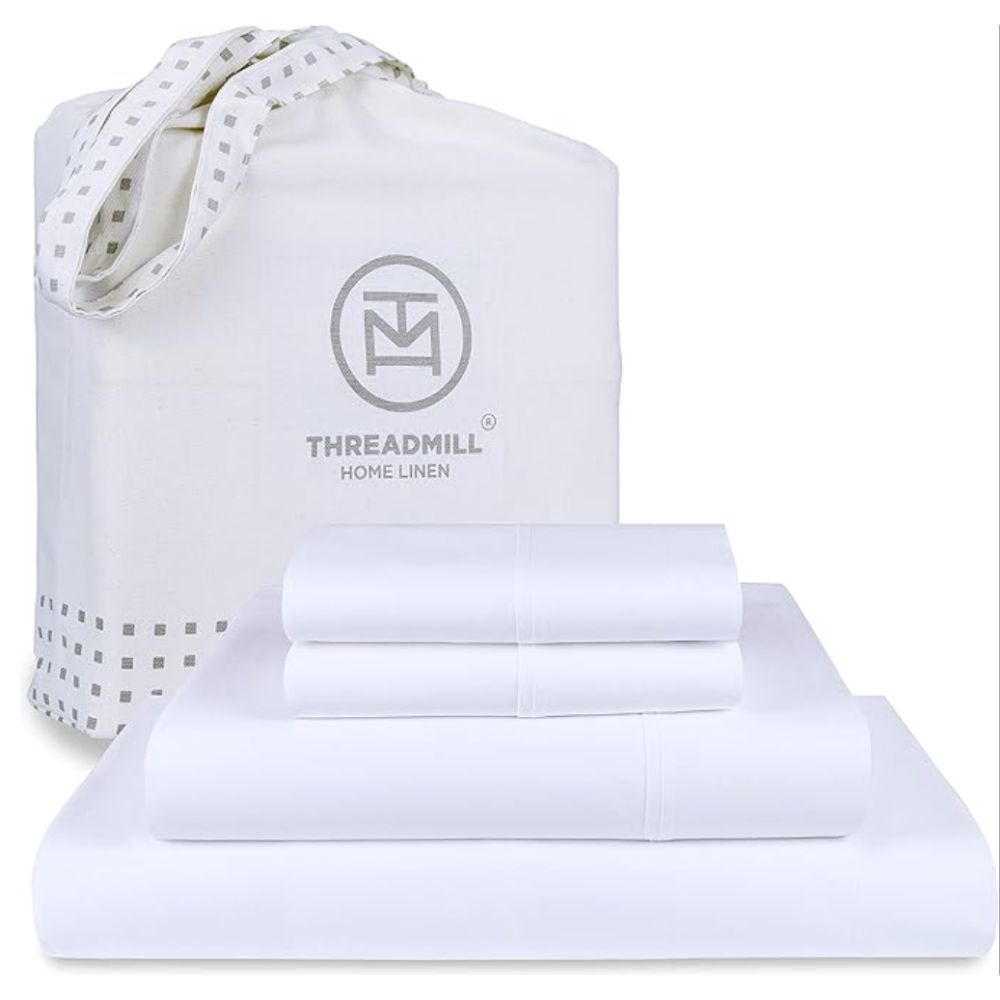 Stack of white sheets and a Threadmill cotton bag