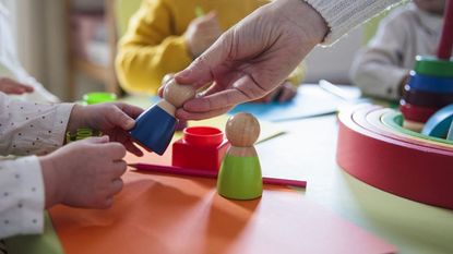 Young children playing with colorful shapes