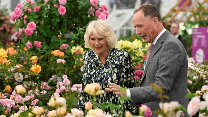 Queen Camilla looks around Chelsea Flower Show with rose breeder David J. C. Austin
