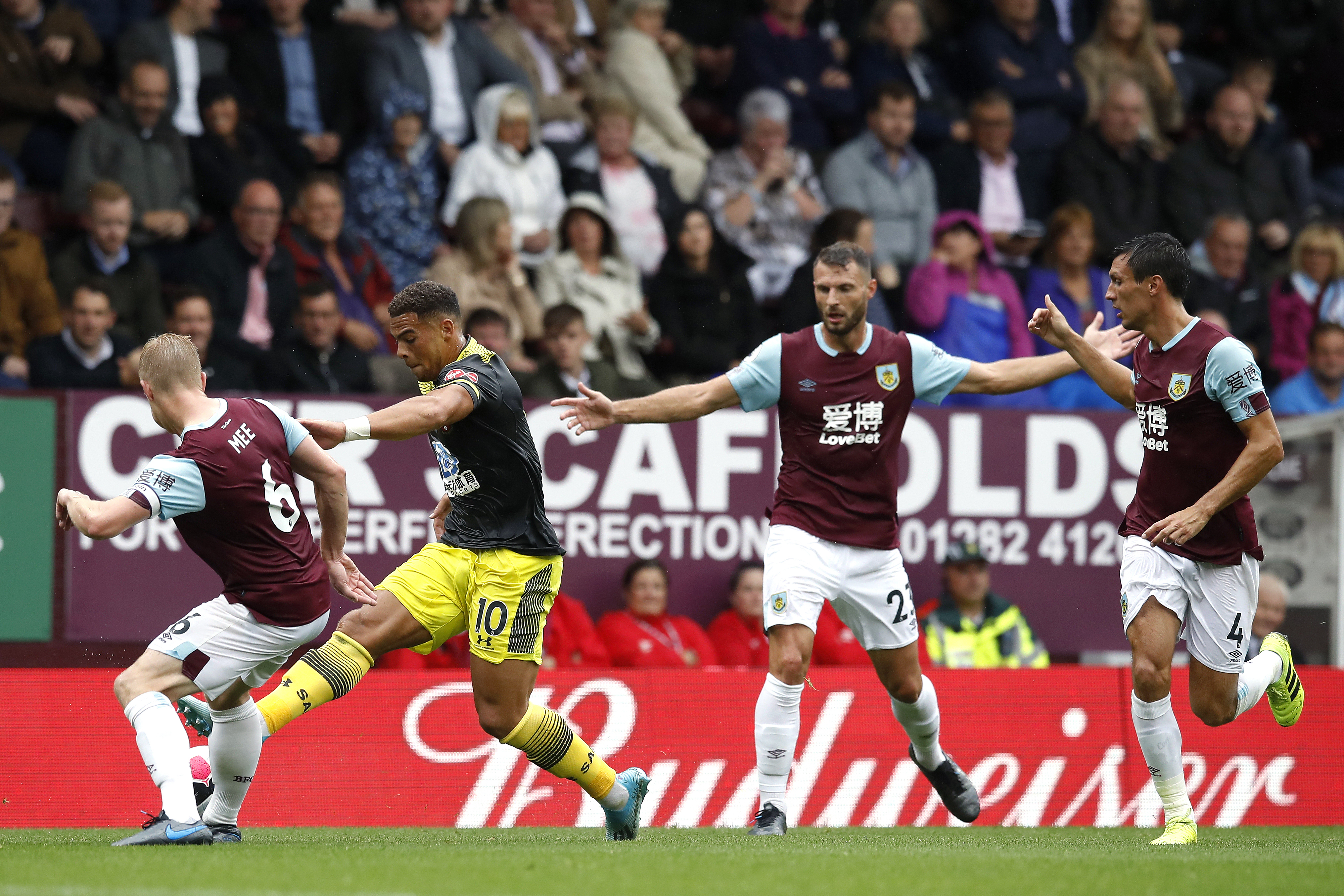 Che Adams, second left, challenges Burnley’s Ben Mee