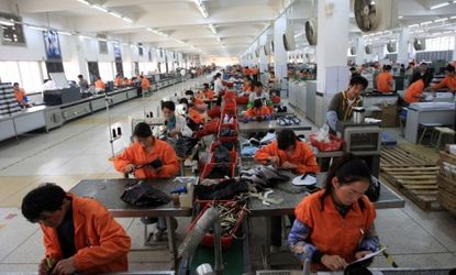 Chinese workers in a shoe factory: China is moving past cheap-supply labor products, like shoes and clothes, and onto higher value work.