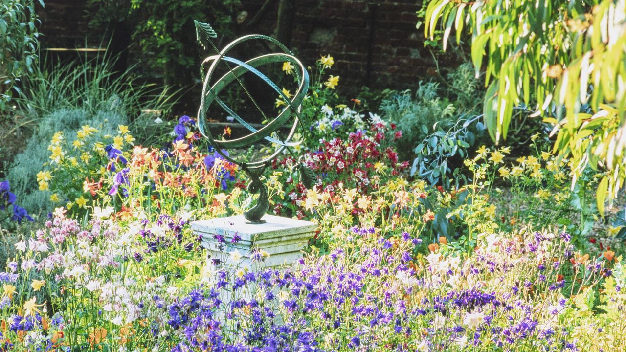 colourful garden with sculpture