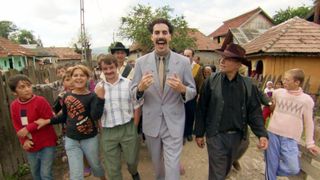 Sacha Baron Cohen in a crowd of people in Borat