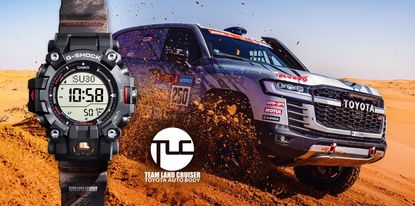 The Casio G-Shock x Toyota Land Cruiser watch beside a Dakar rally car