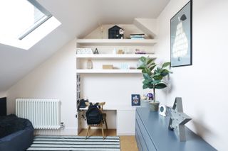 loft conversion with handy storage solution by archea