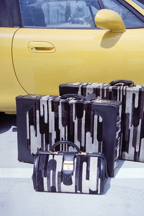 Embossed box calf leather suitcases and vanity case, 1968